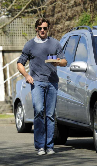 Illustration for article titled Halle Berry Brings Out The Baby • Hugh Jackman Goes Java